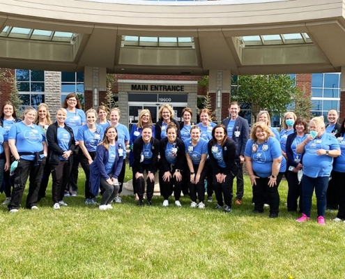 Group photo of hospital staff at Counterpoint wearing One Day Closer shirts.