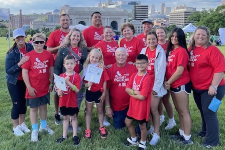 Group photo of a family at the Donate Life Legacy Walk in red t-shirts.