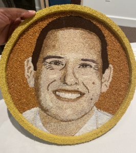 A floragraph portrait of a man smiling.